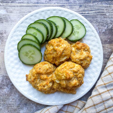 Stuffed Crab filling on a plate with cucumber.