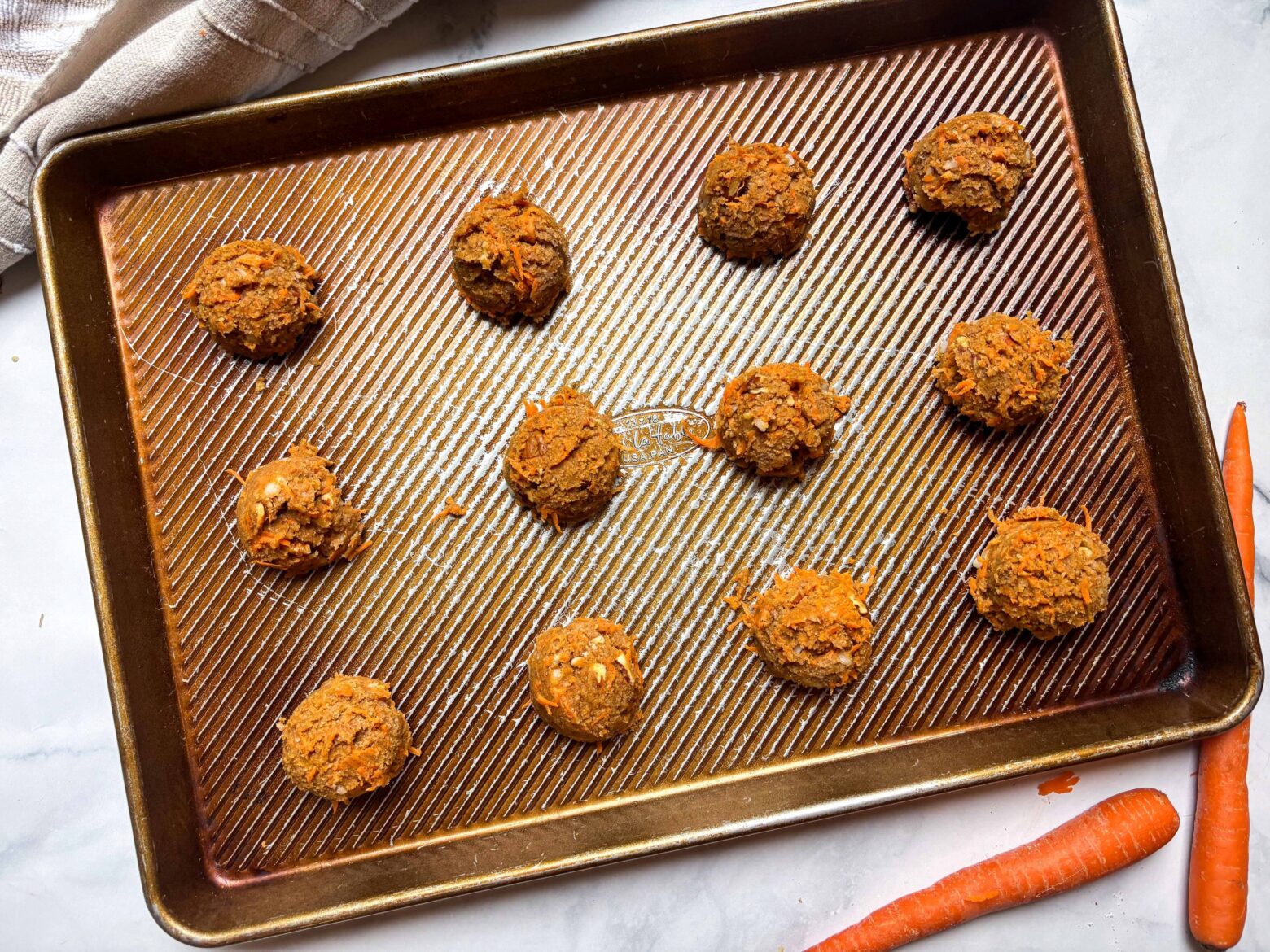 Uncooked Carrot Cake Breakfast Bars on a baking sheet