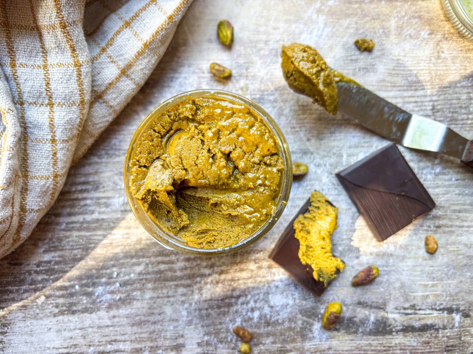 Pistachio butter in a jar.