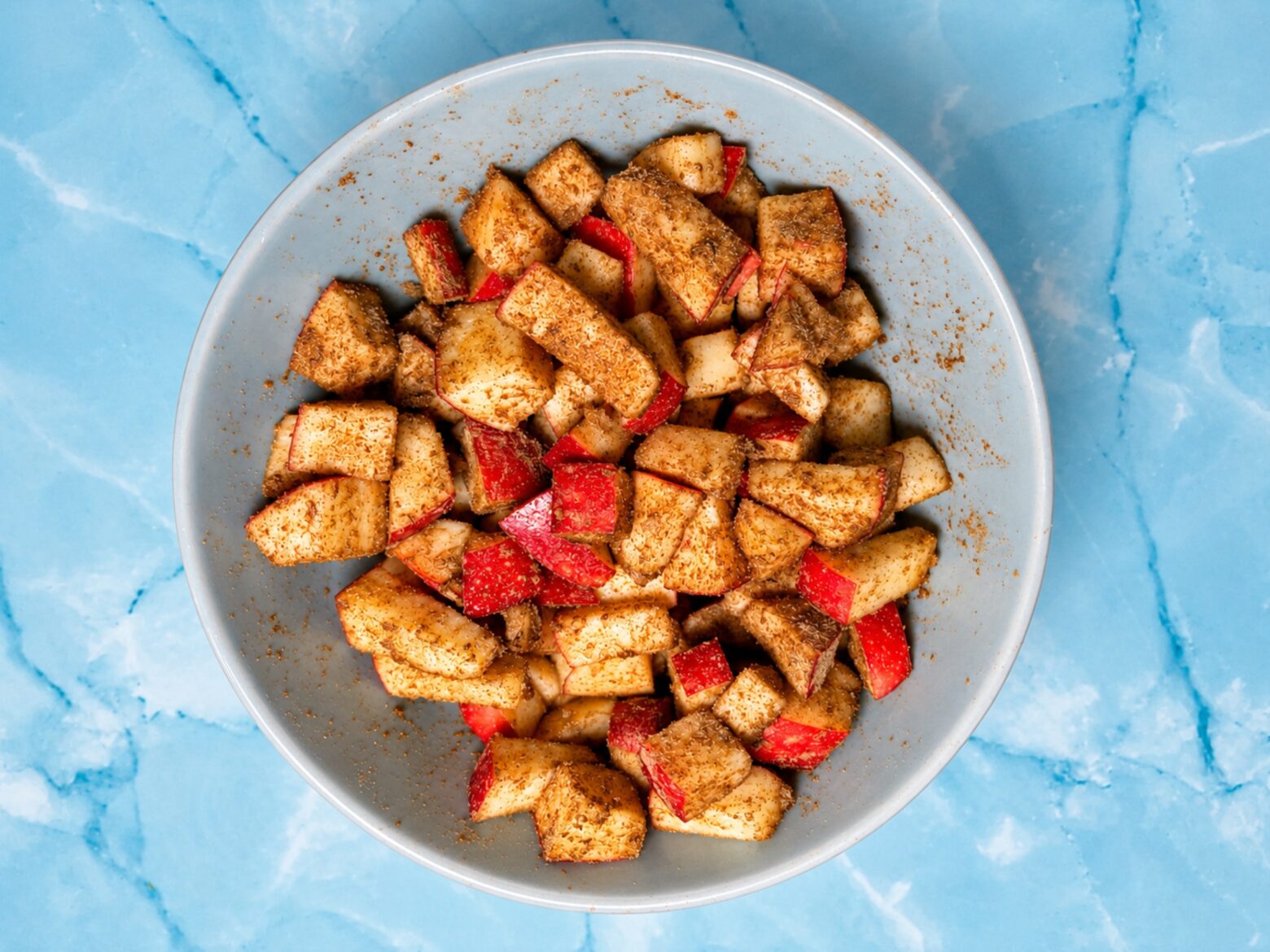 Apples coated with maple syrup and sage.