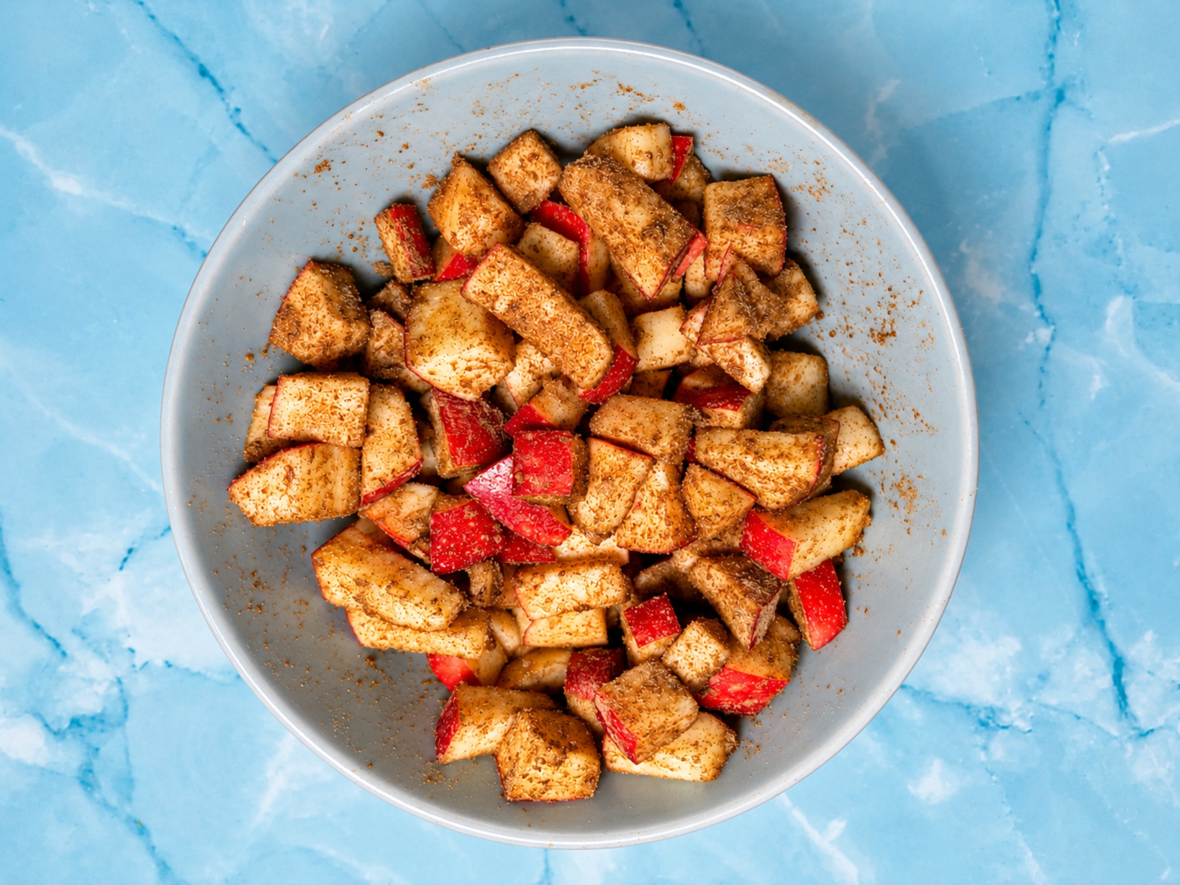 Apples coated with maple syrup and sage.