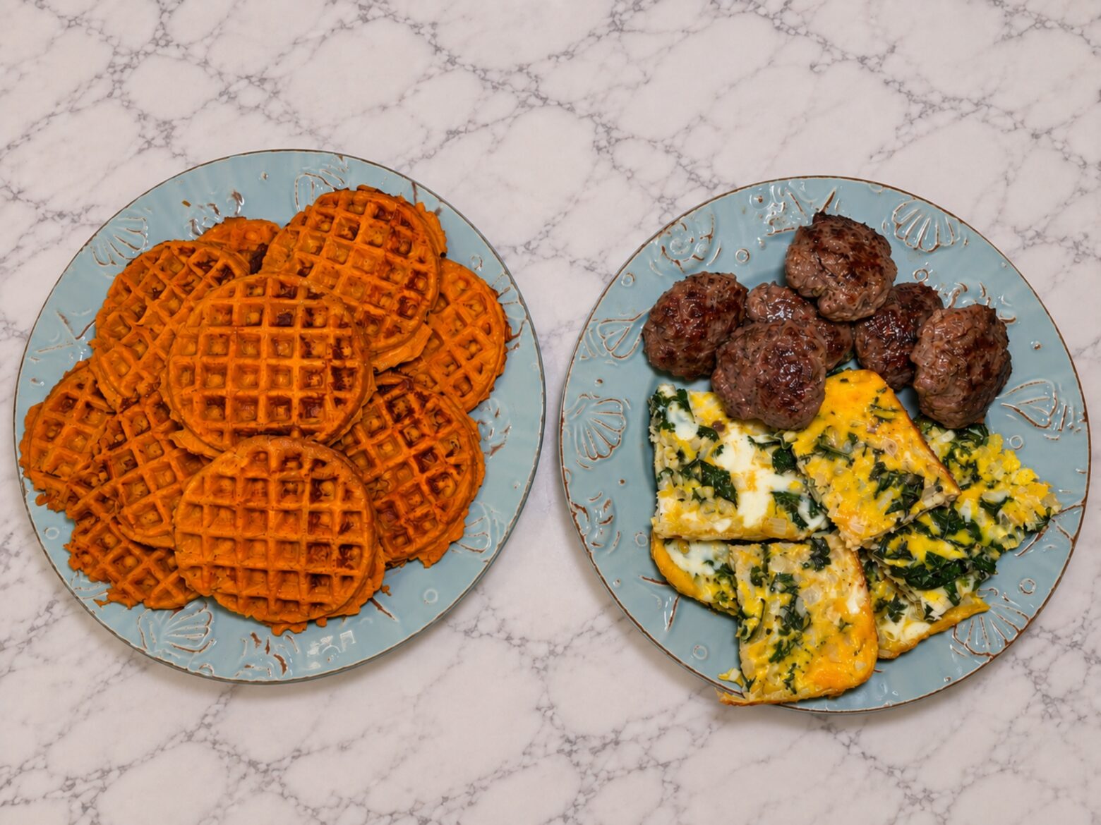 Ingredients for breakfast sandwiches on separate plates.